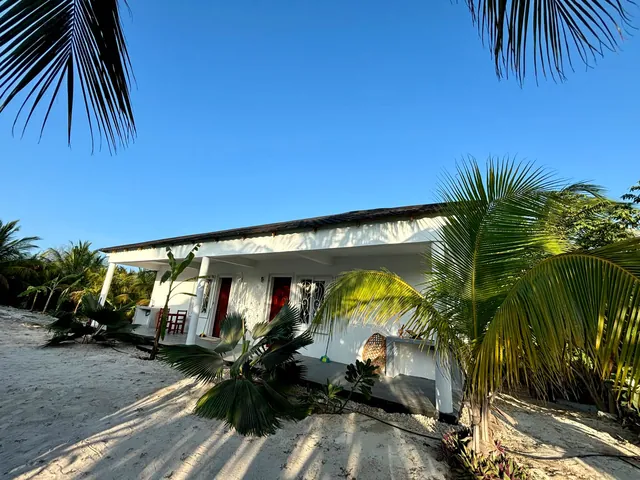 Double bungalow with covered terrace in the sandy garden