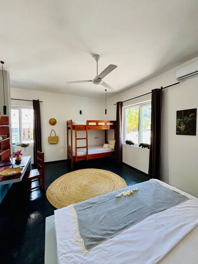 Room in the double bungalow with double bed, bunk bed and ceiling fan